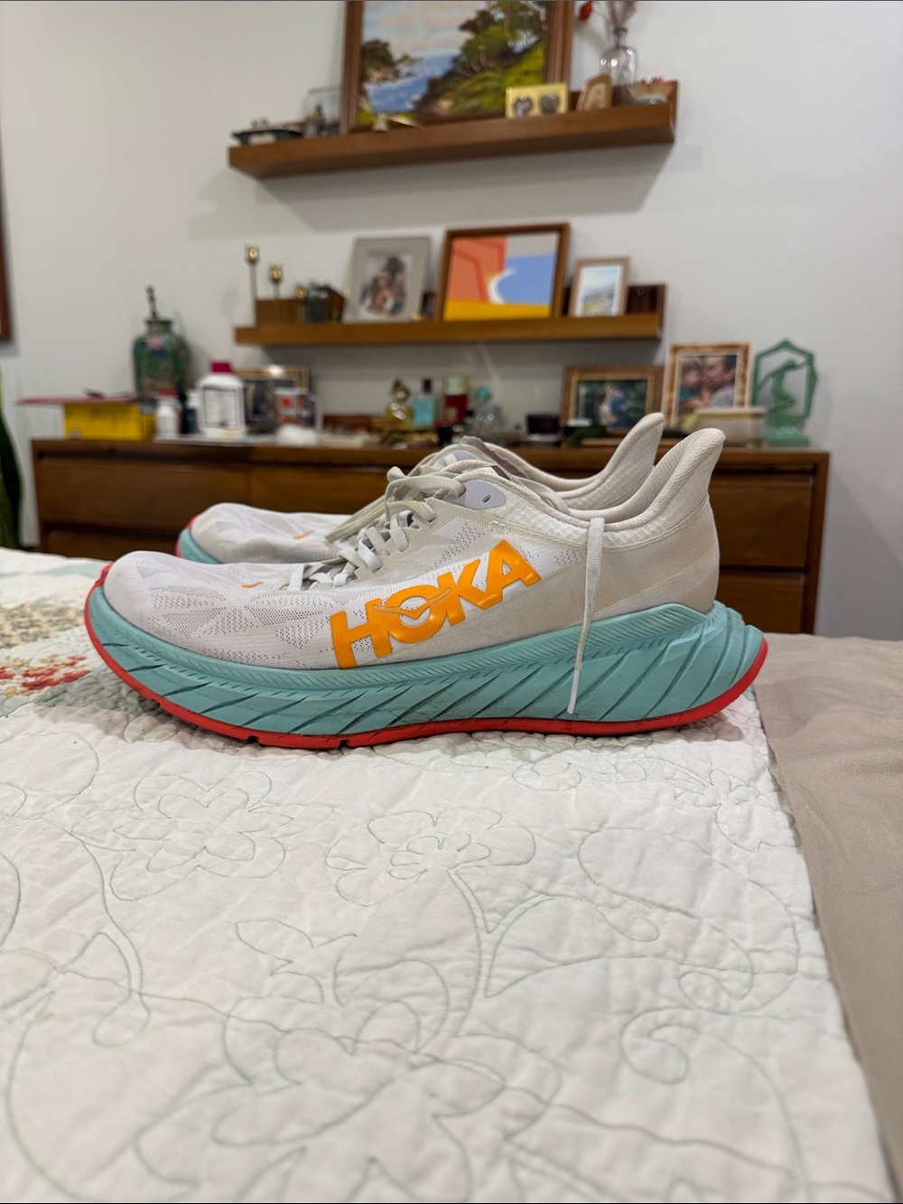 Hoka men’s Carbon X carbon plate racing Shoes with Teal Midsole and Orange Logo